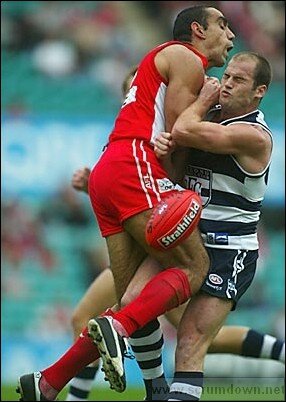 adam goodes and paul chapman get up close and personal.JPG
