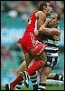 adam goodes and paul chapman get up close and personal.JPG